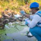 900-water-resource-experts-check-the-water-quality-in-a-community-canal-contaminated-with-garbage-in-the-canal-1