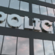 900_medium-police-sign-on-a-modern-glass-skyscraper-police-glass-building-3d-rendering-1