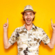 900_medium-vecteezy_a-young-happy-male-tourist-isolated-on-a-yellow-background_6863310_medium