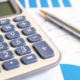 900_medium-vecteezy_calculator-on-graph-paper-finance-development-banking_5663431_medium