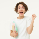 900-excited-and-enthusiastic-girl-feeling-thrilled-makes-fist-pump-and-screams-from-joy-posing-with-notebook-against-white-studio-background