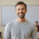 900_large-vecteezy_ai-generated-a-handsome-male-teacher-smiles-in-classroom_37009831_large