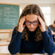 900_large-vecteezy_stressed-female-student-wearing-glasses-focusing-on_78028451_large