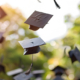 900_medium-vecteezy_graduation-mortarboards-caps-flying-in-the-air-graduation_54403336_medium