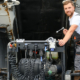 900-semi-truck-under-maintenance-caucasian-truck-mechanic-working-to-fix-the-tractor